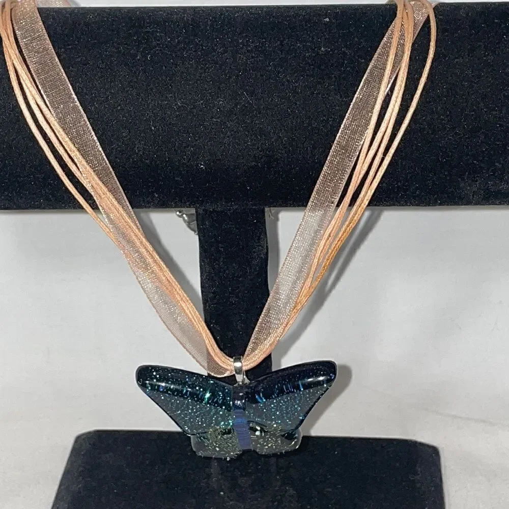 Ribbon necklace with a butterfly glass emblem